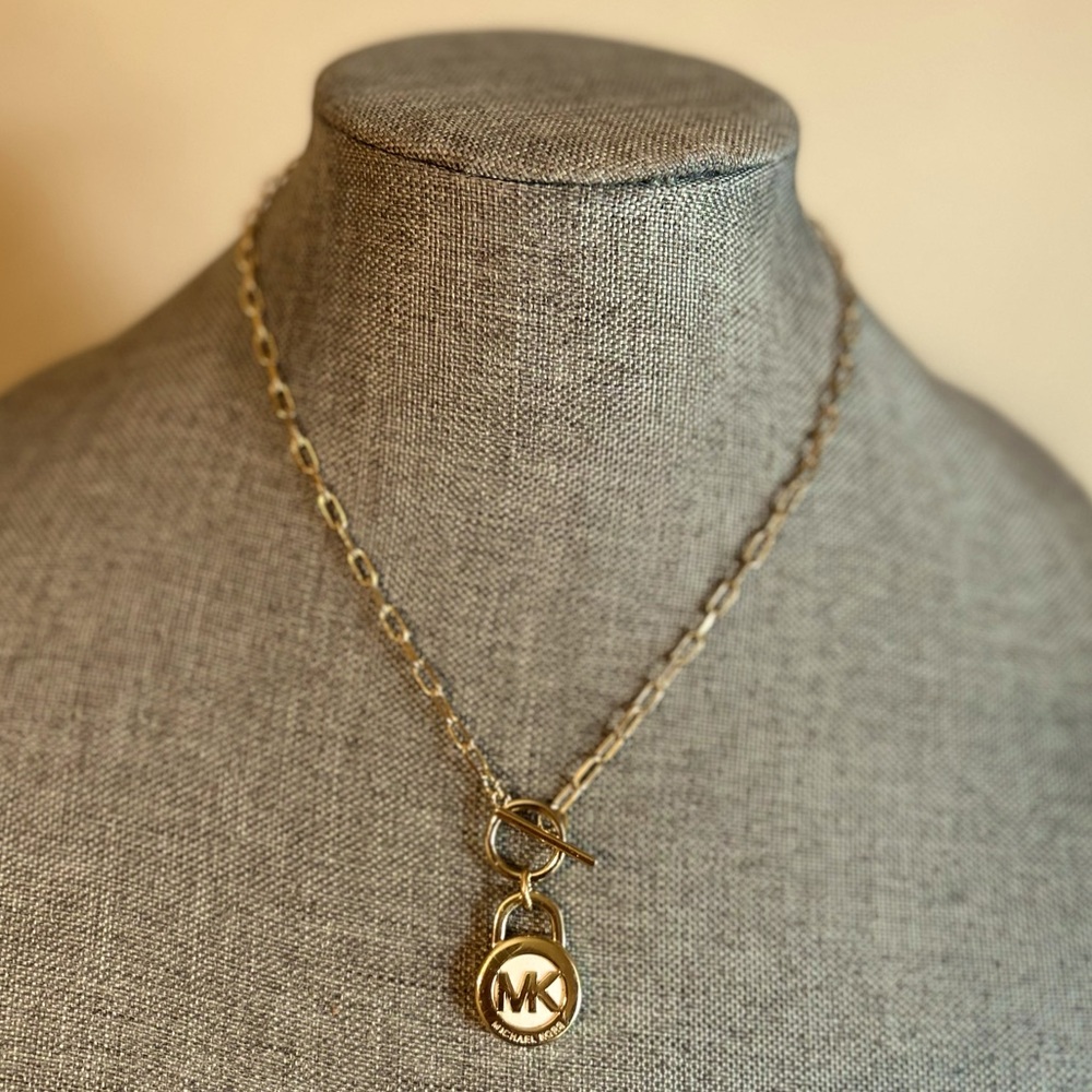 Authentic Michael Kors lock charm on 18" unbranded paper clip toggle chain